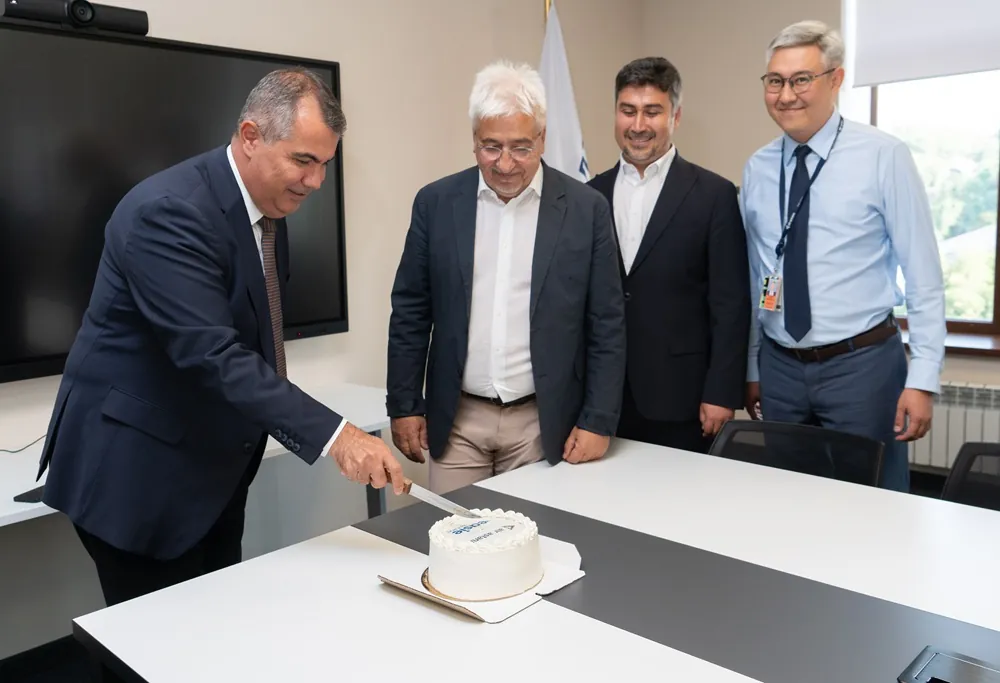 Air Astana and easie by ICRON representatives celebrating the go-live